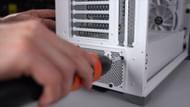 Installation of PSU to build a new gaming PC (Image via TechSource/YouTube)